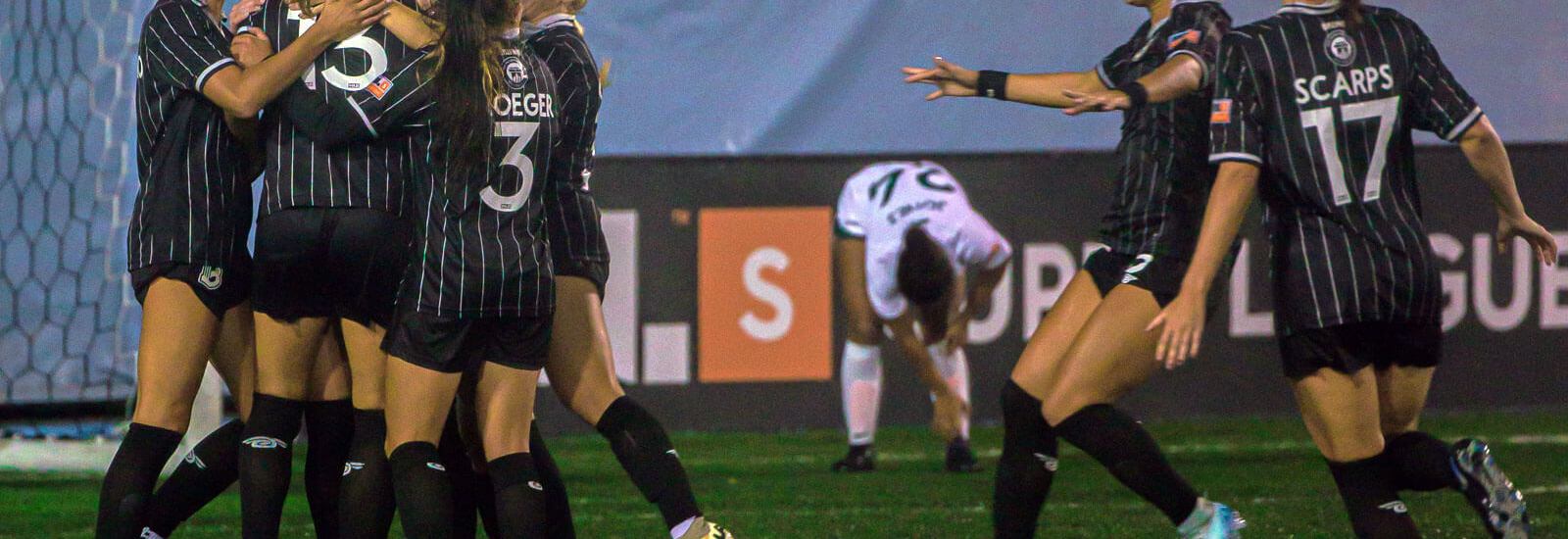 BKFC teammates celebrate on the field against Lexington SC
