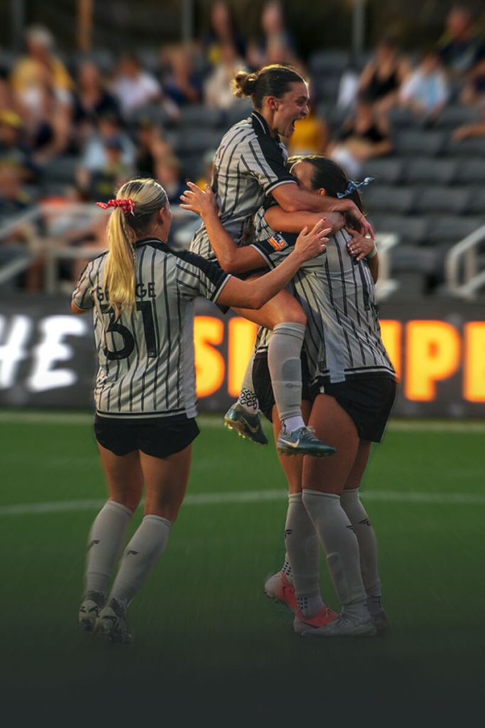 Image of the Brooklyn FC women cheering after scoring