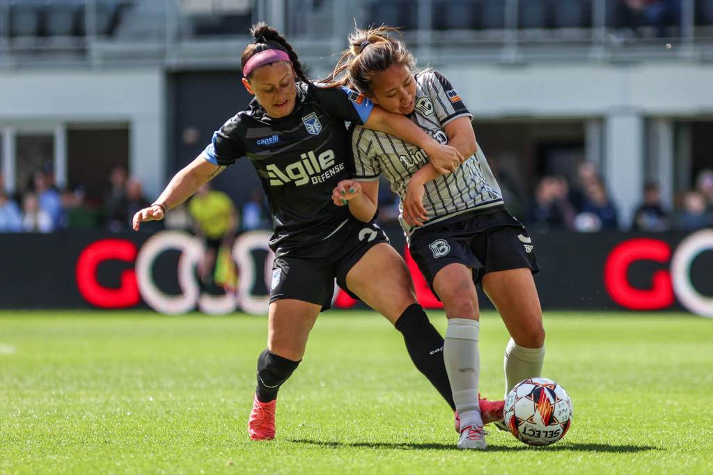Sam Kroeger battles an opponent for the ball against DC Power FC on March 23, 2025