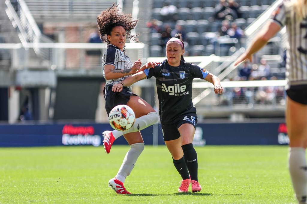 Salma Amani battles an opponent for the ball against DC Power FC on March 23, 2025