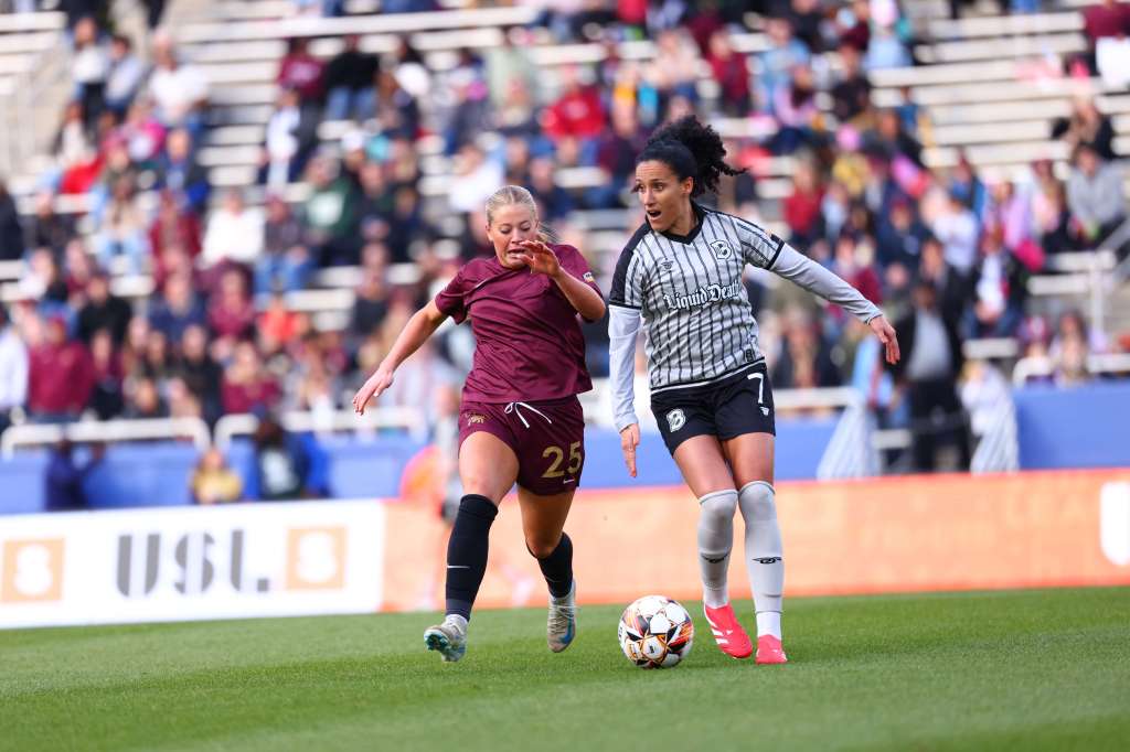 Salma Amani dribbles against a defender during a match against Dallas on 9 March, 2025