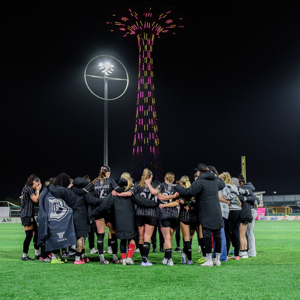 Brooklyn FC women's team huddles at midfield after their match against Tampa Bay on March 30, 2025