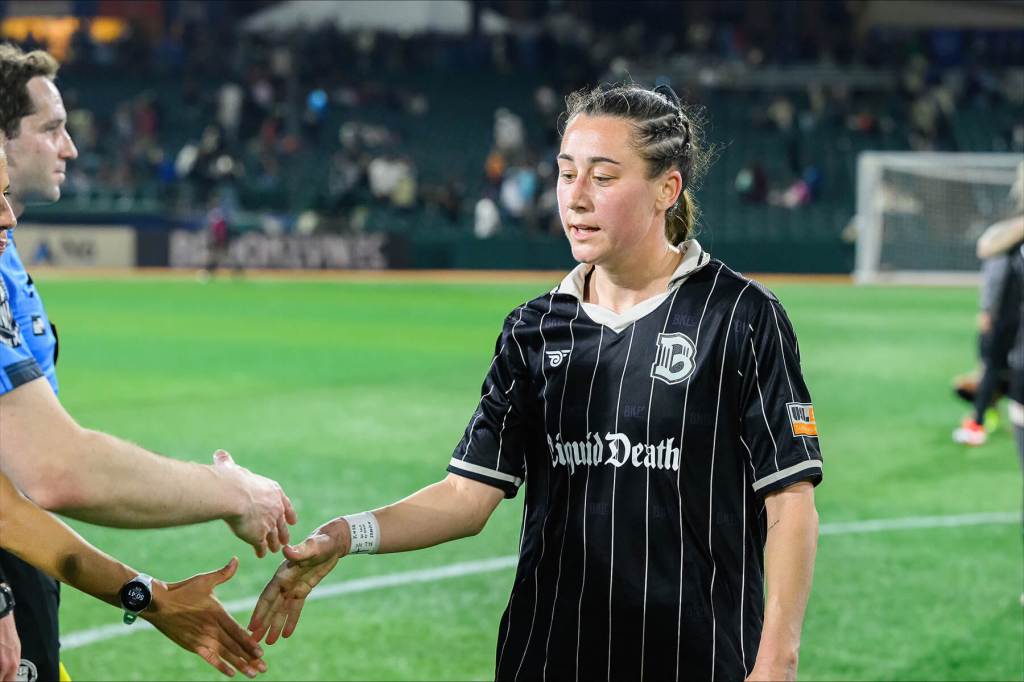 Brooklyn FC midfielder Hope Breslin is congratulated by teammates during a match aginst Lexington on April19, 2025