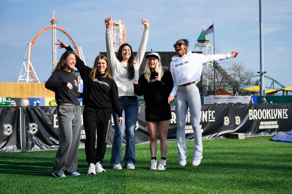Group of fans cheer outside the stadium before a Brooklyn FC match