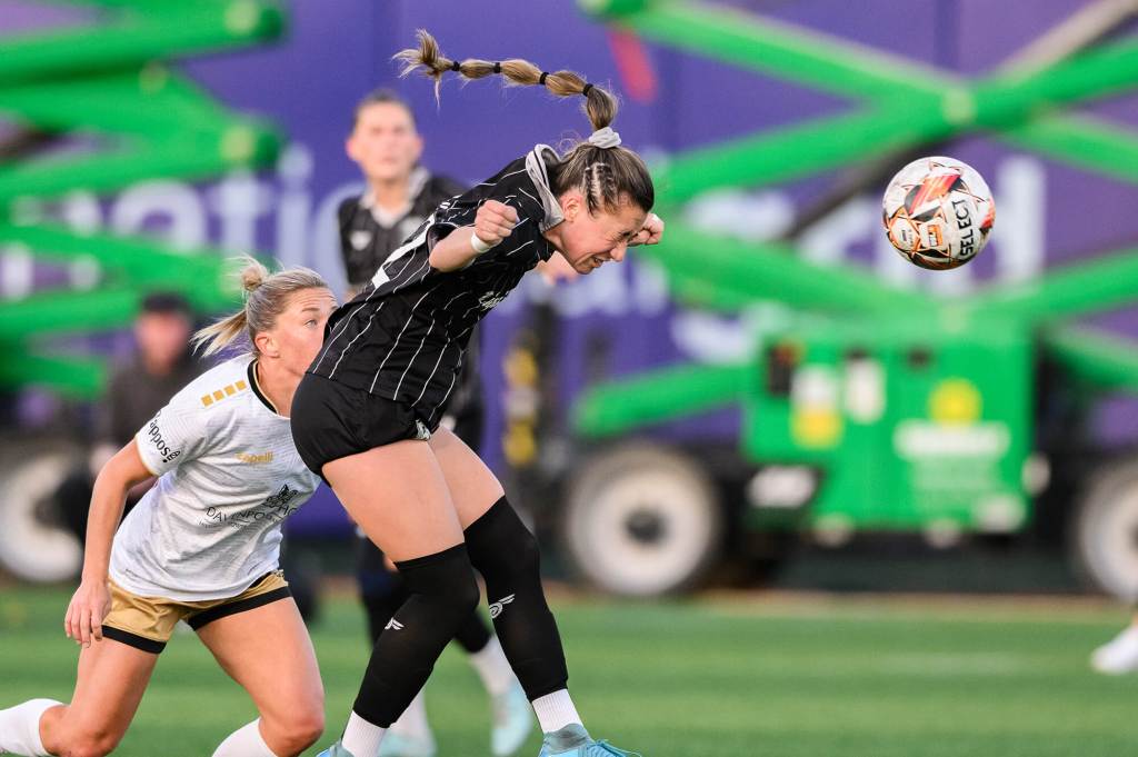 Hope Breslin heads the ball away from an opponent during Brooklyn FC's match against Spokane Zephyr on May 10, 2025
