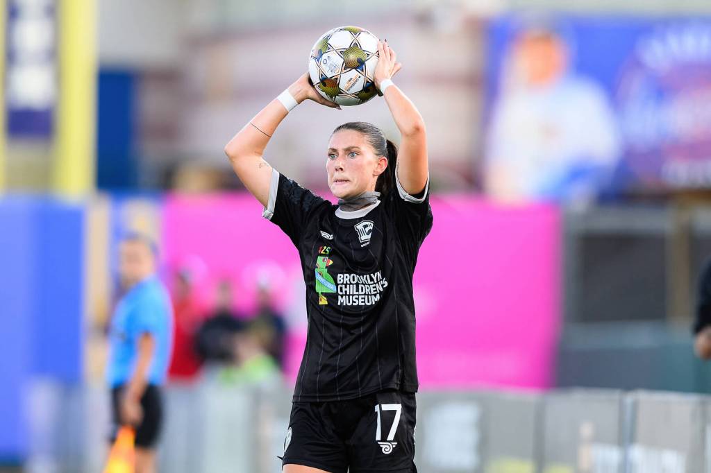 Leah Scarpelli prepares to throw in from the sidelines against Tampa Bay on August 23, 2025