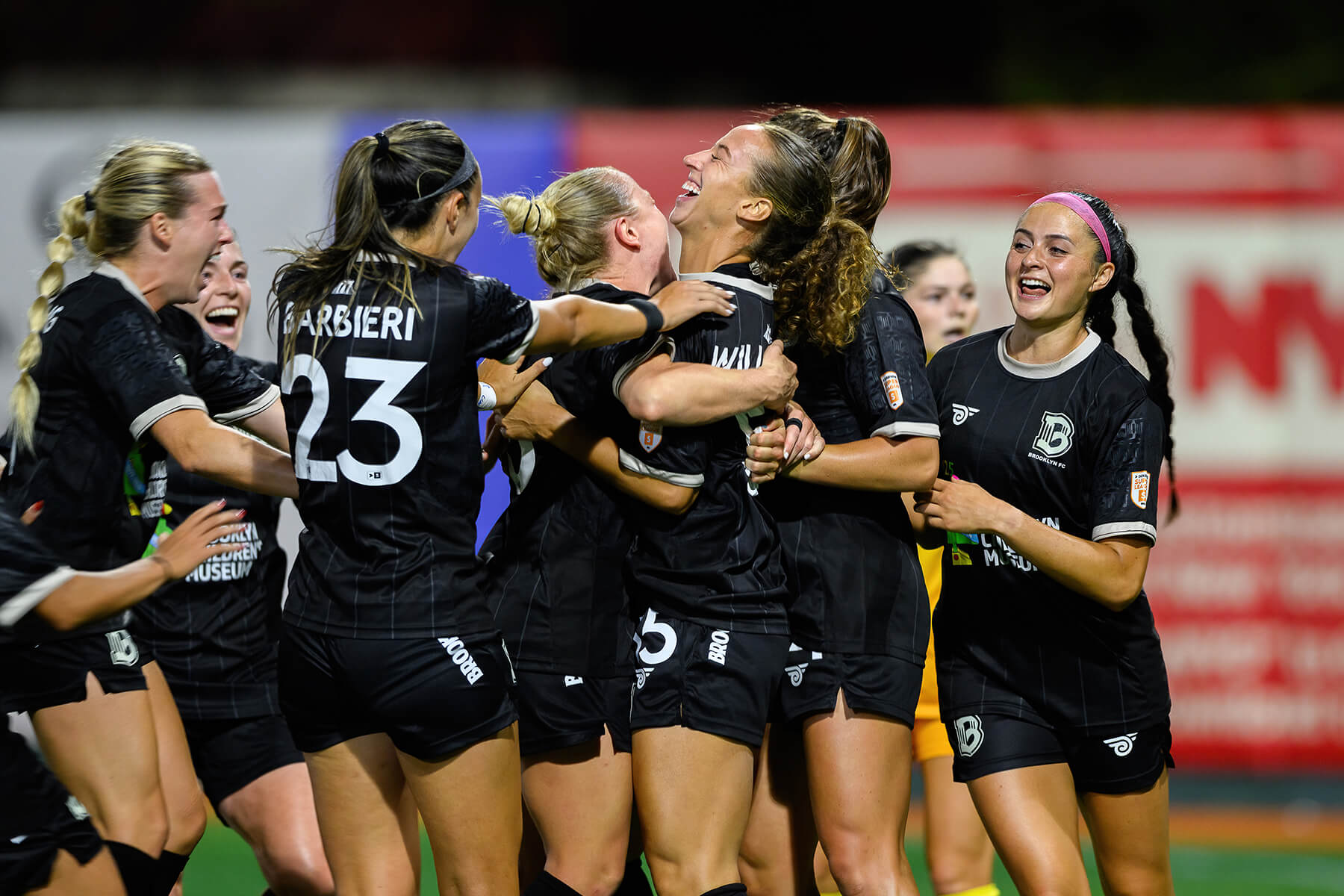 Brooklyn players celebrate Allison Williams goal against Tampa Bay on August 23, 2025