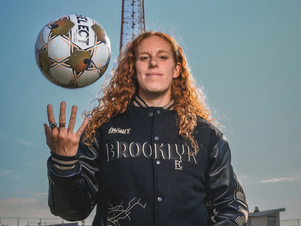 Sam Rossette wears the new DAÖMEY Limited-Edition Brooklyn FC Varsity Jacket