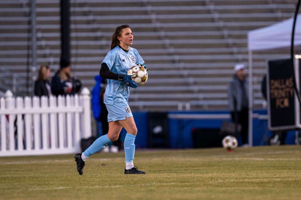 Brooklyn FC goalkeeper Kelsey Daugherty holds the ball during a match against Dallas Trinity FC