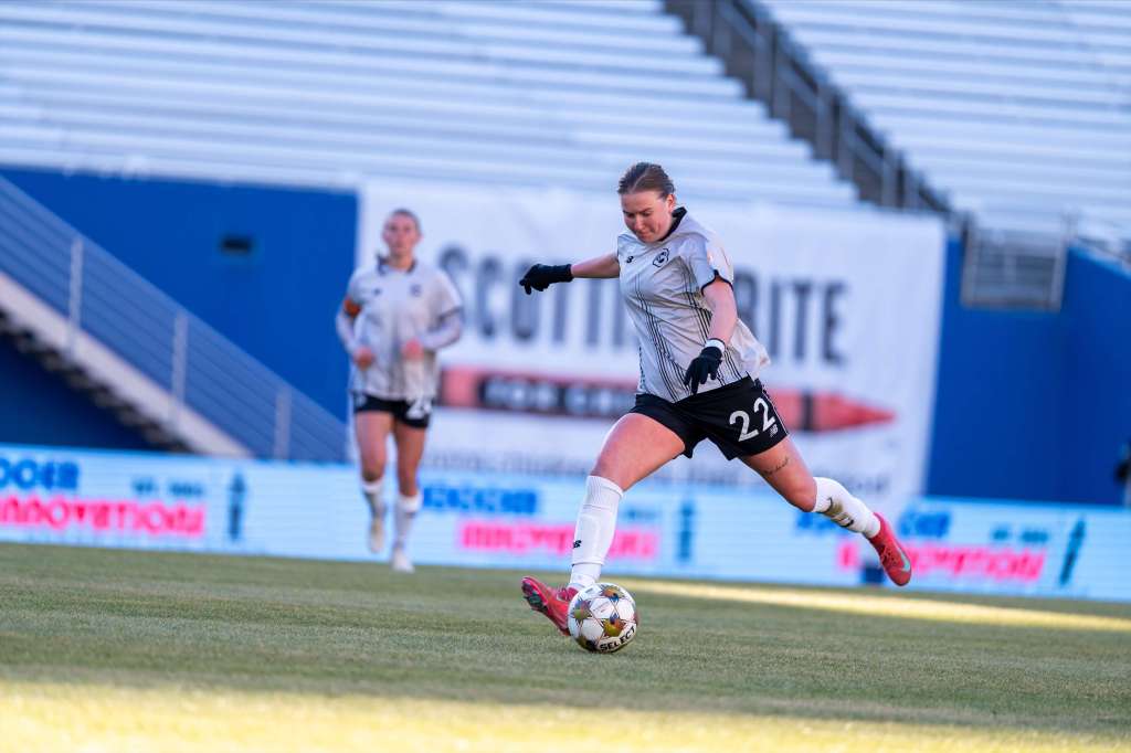 Brooklyn FC defender Lauren Gogal strikes the ball during a match against Dallas Trinity FC