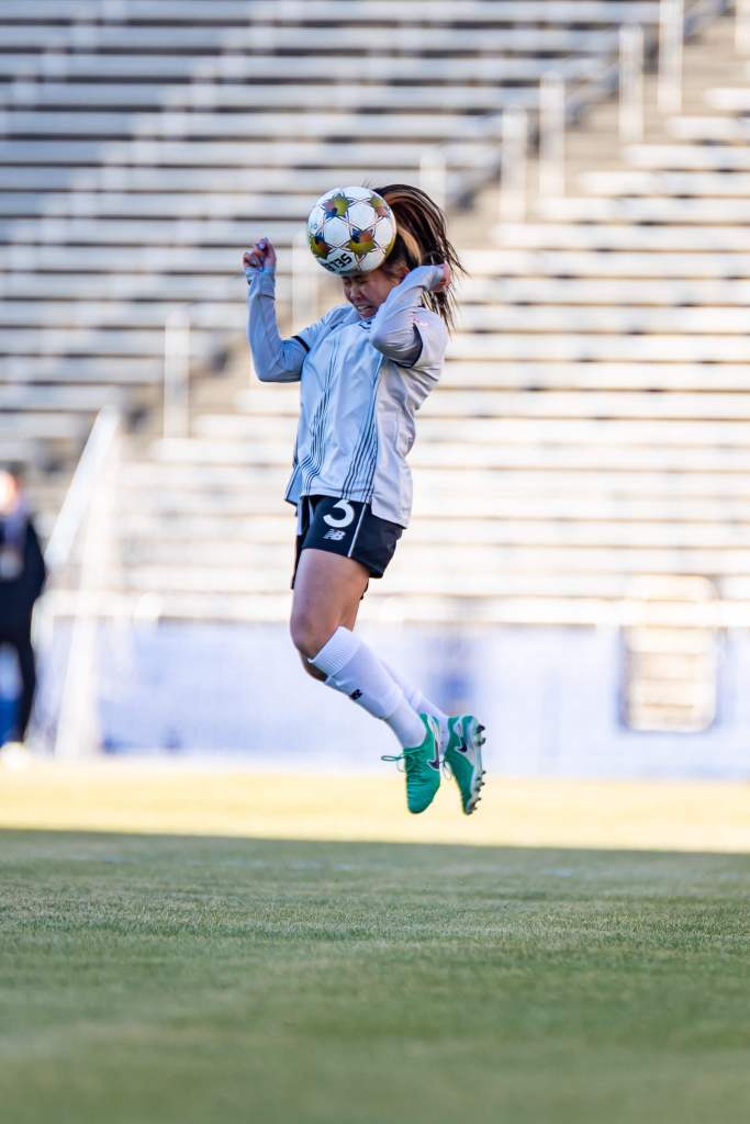 Brooklyn FC midfielder Samantha Kroeger rises to head the ball during a match against Dallas Trinity FC
