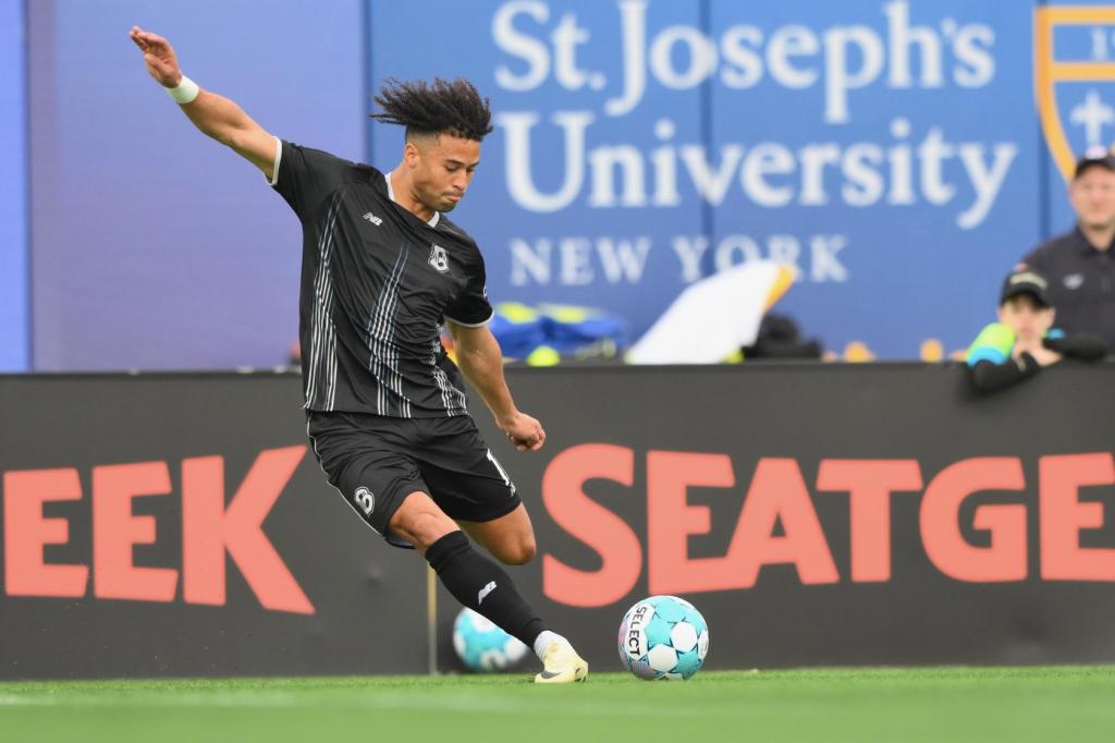Jaden Servania of Brooklyn FC strikes the ball during a match at Maimonides Park.