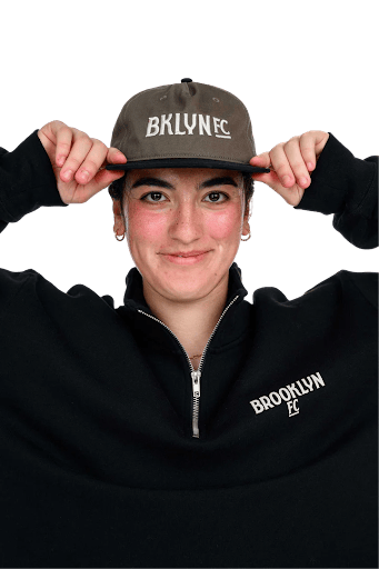 A member of the Brooklyn FC team reps the new merch for the team