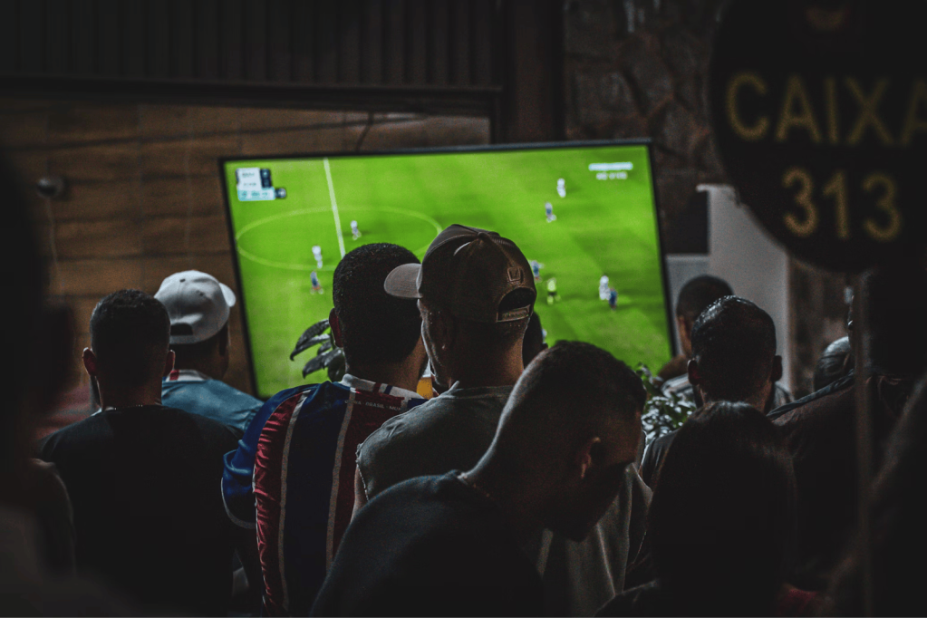 Friends view a Brooklyn FC match at a local bar